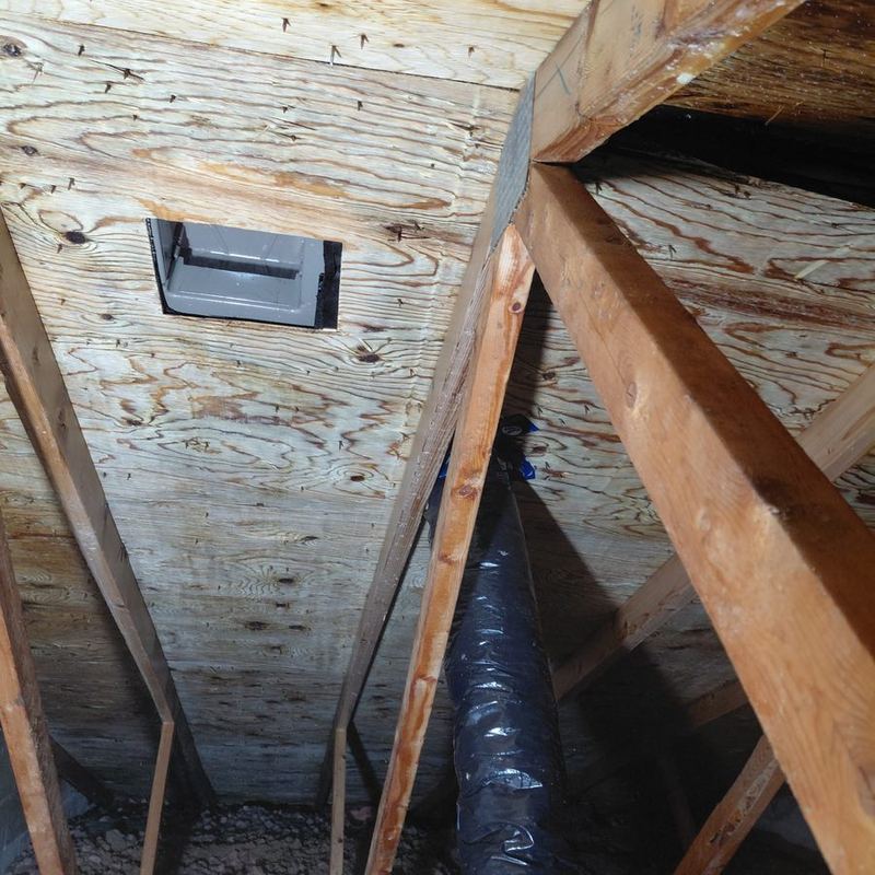 The same attic cleaned up with a new insulated duct run and clear sheathing