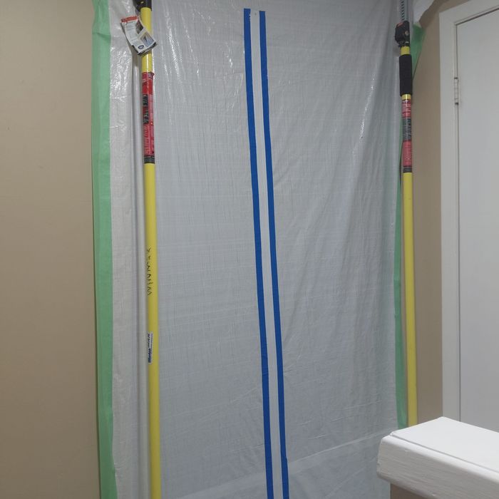 Sealed containment barrier with zipper access door