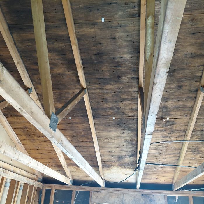 Mold-stained plank roof sheathing