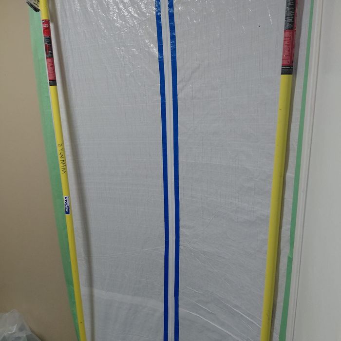 Containment sealing off the work area from the home