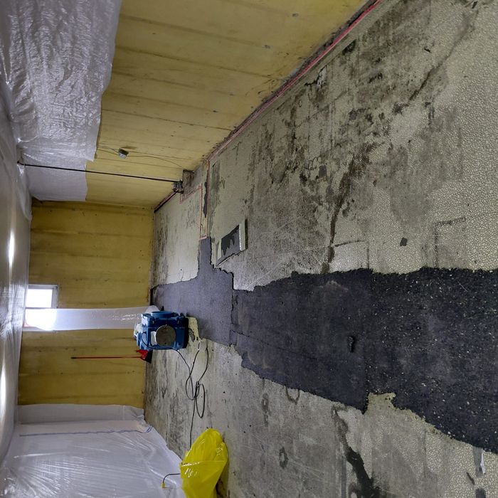 Foundation wall stripped for remediation